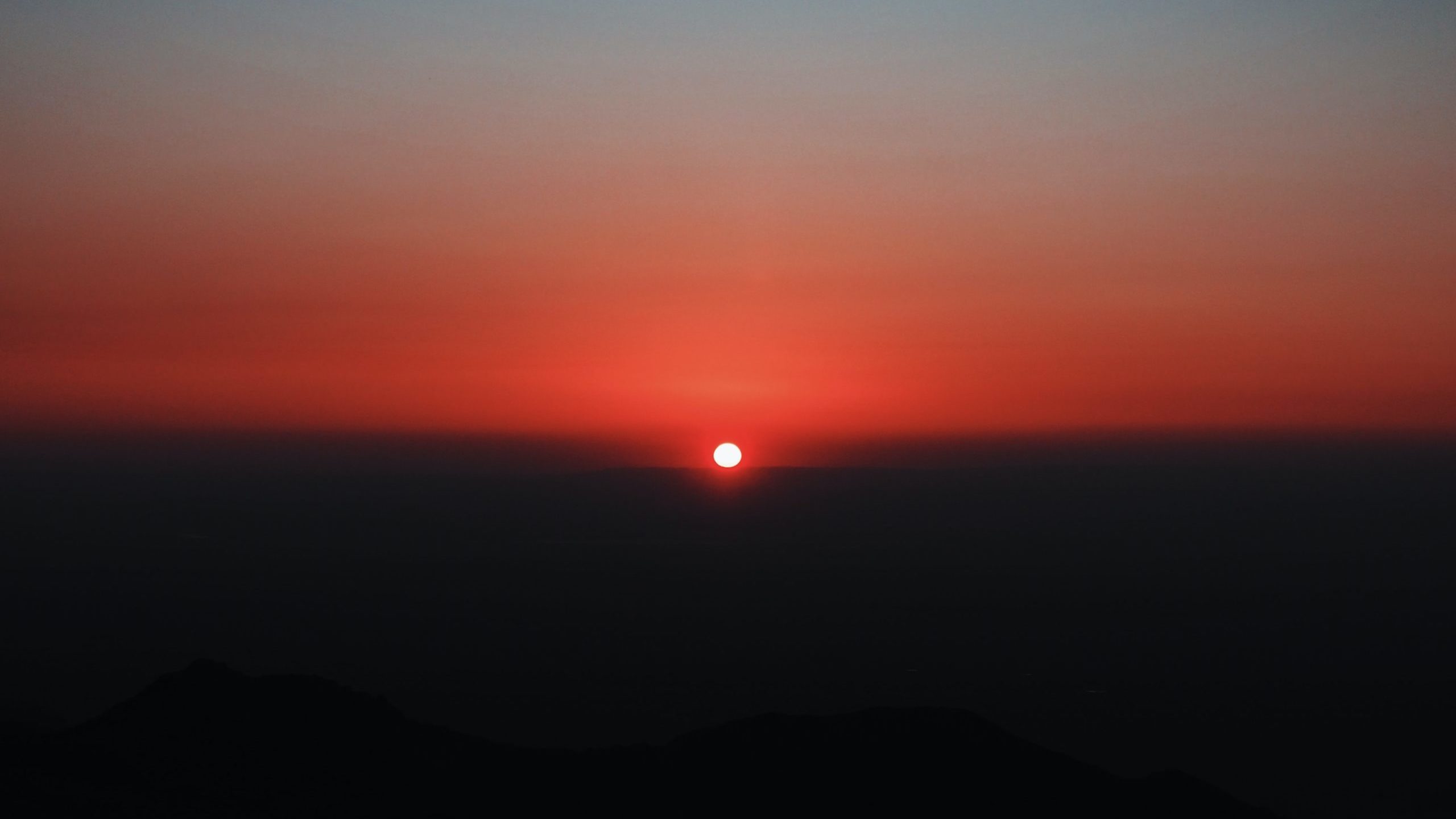 silhouette of mountain during sunset